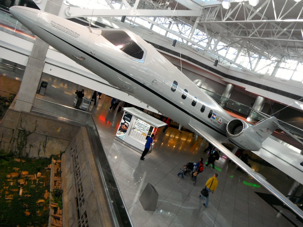 This plane holds the Official Around the World Speed Record at 49 hours 21 minutes. As seen hanging from the ceiling in concourse C at the Denver airport.